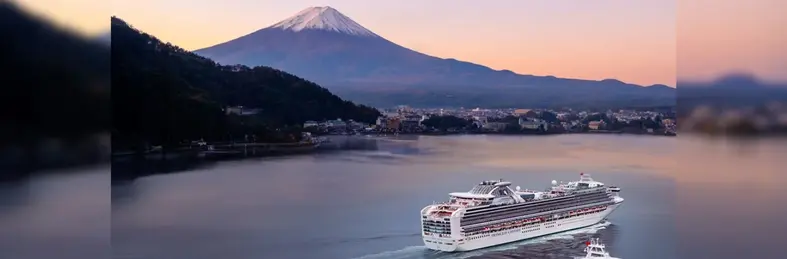 A Princess Cruises ship sailing past Mount Fuji in Japan.