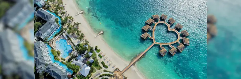 Overwater villas shaped like a heart at Sandals South Coast.