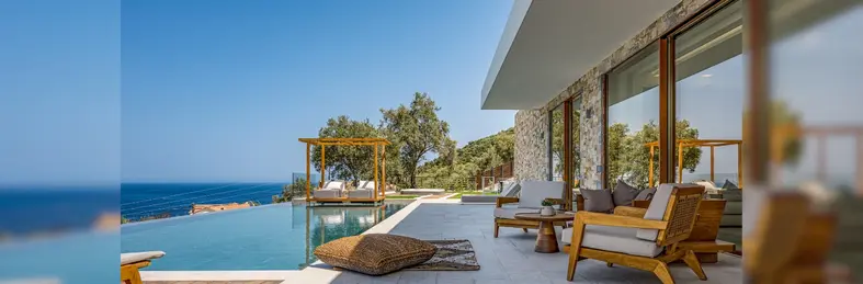 A view of the infinity pool, outside deck and sea on the horizon from Aurora Thesan in Zakynthos. 