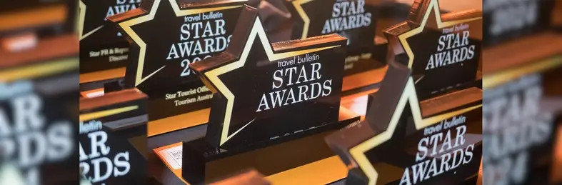 A lineup of Travel Bulletin Star Awards trophies.