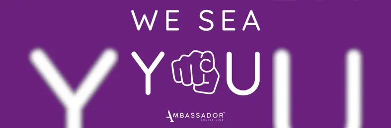 An Ambassador Cruise Line banner declaring 'We Sea You', celebrating National Travel Agent Day.