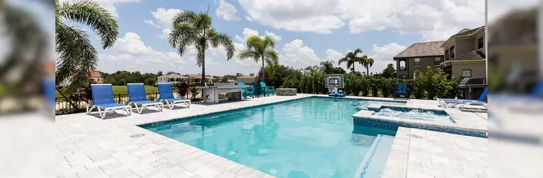 The pool area at The Bohemian Chic Oasis, a villa in Reunion, Florida.