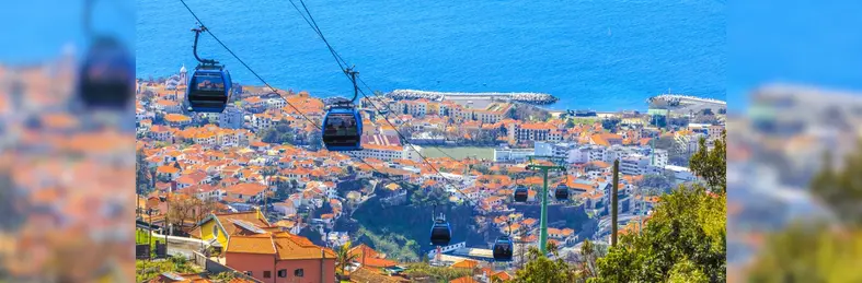 Cable cars travelling over Funchal, Madeira.