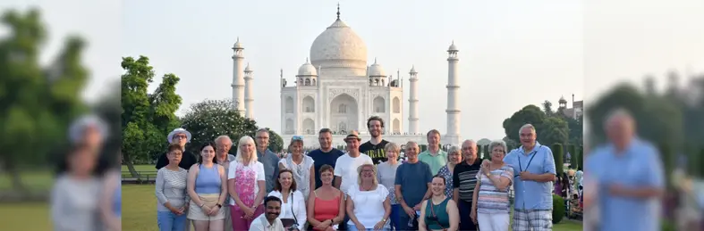 A group of Travelsphere customers and tour guides in front of the Taj Mahal in India.