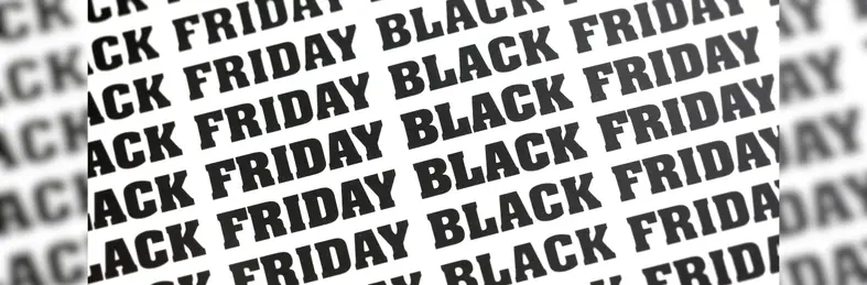 A print repeating the words BLACK FRIDAY in bold, black typeface.