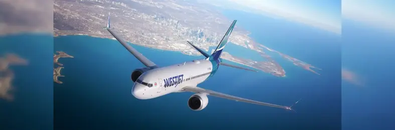 WestJet plane flying over Toronto