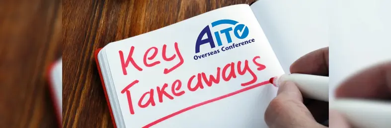 A notepad on a wooden table with 'Key Takeaways' written in red marker.