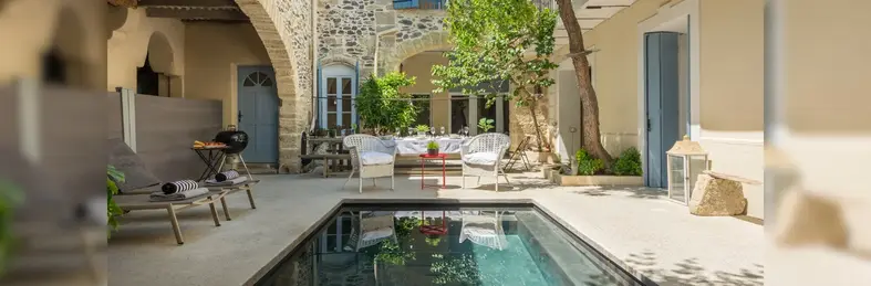 The outdoor pool area at Chez Le Vigneron, a villa in the south of France.