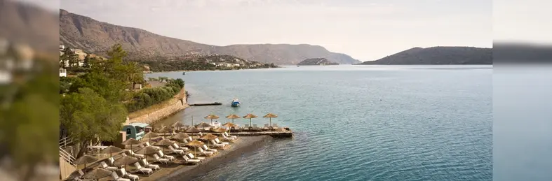 The beachfront area at Domes Aulūs Elounda.