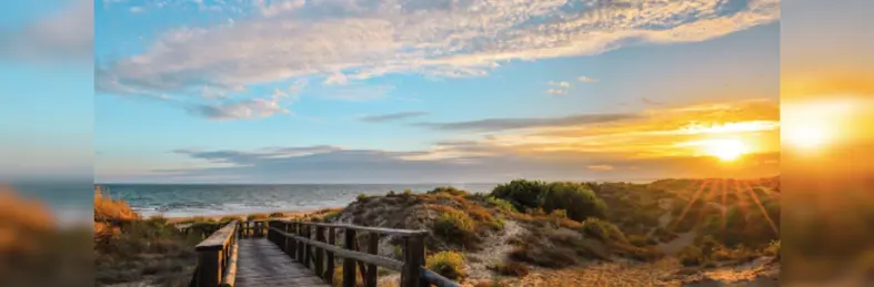 A sunset over the beach of Punta Umbría, located in Huelva, Spain. 