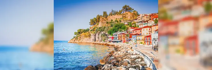 icturesque coastal town in Epirus region of Praga, Greece with sunrise and colorful houses