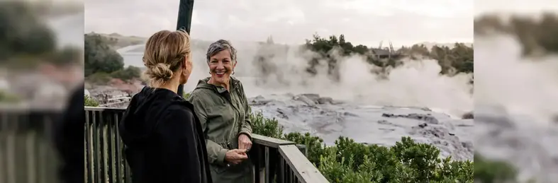 Two ladies overlooking a waterfall