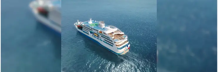 Aranui Cruises new cruise-cargo ship, Aranoa, sailing on a sunny day