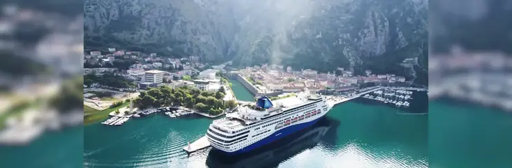 Celestyal ship in port with mountains behind
