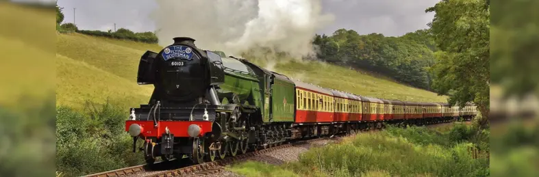 The Flying Scotsman locomotive chugging through the countryside