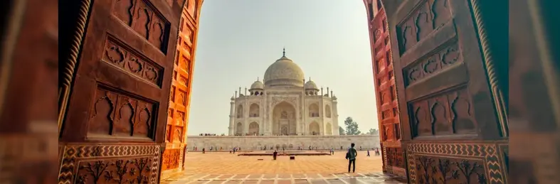 The Taj Mahal seen through a large entrance way
