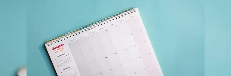 A spiral-bound monthly 2026 calendar, open on the January page.