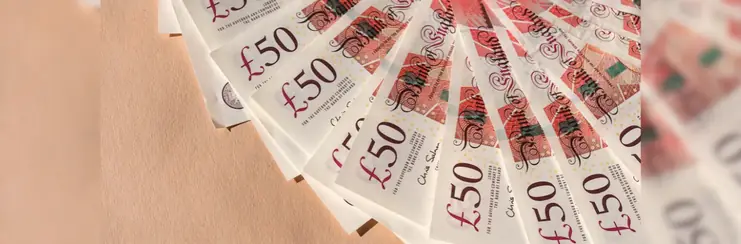 Fanned out £50 notes on a table