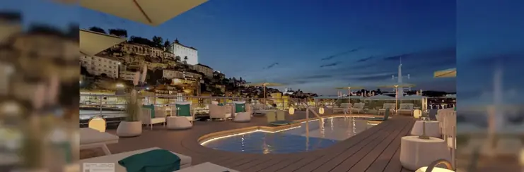 The top deck of Amadeus Douro, with a pool, sun loungers and couches. 