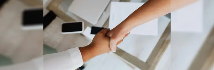 Hands shaking in agreement over a new partnership