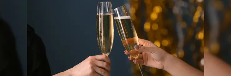 Two glasses of champagne toasting