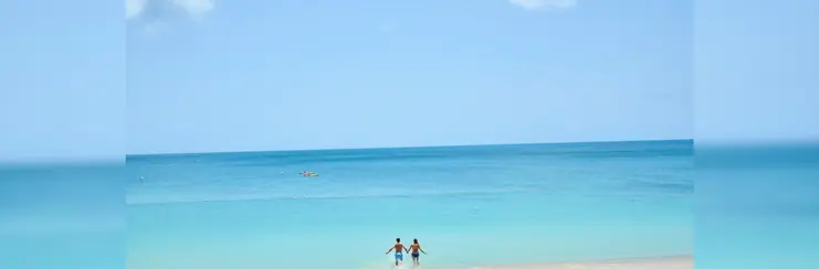 A couple running into the sea together