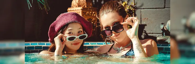Two women with sunglasses in a hot tub