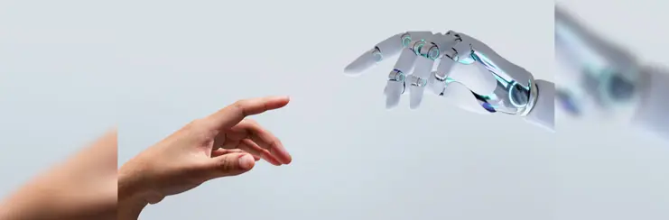 Human hand reaches for robotic hand