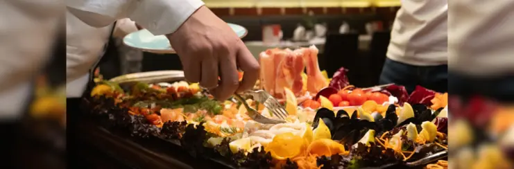 European meat cuts on plate at buffet