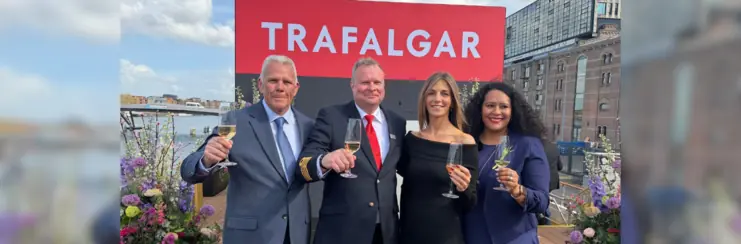 Damien O'Connor, captain Alexander van Der Graaf, Cassie Estrella-Roca, and Melissa DaSilva in front of Trafalgar sign