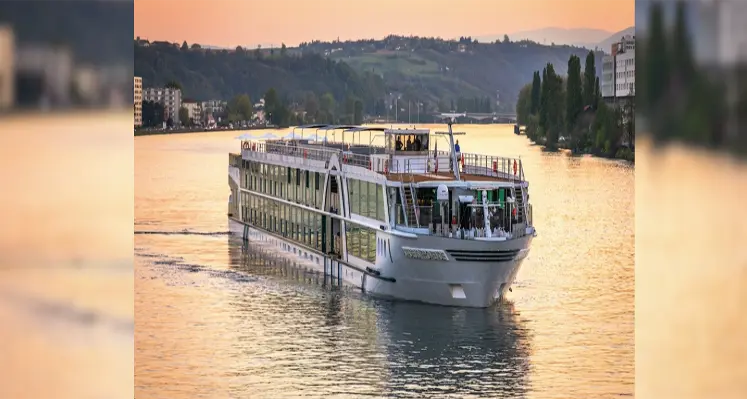 Amadeus vessel sailing in the sunset. 