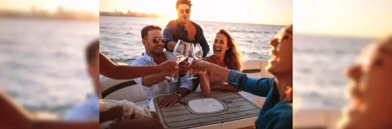 A group of friends raising a toast on a boat.