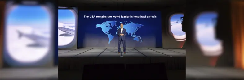 Chris Thompson, president & CEO of Brand USA, on stage at IPW 2024.