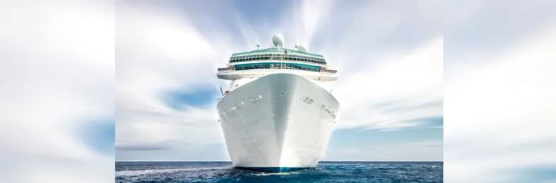 The hull of a ship, sailing towards the camera.