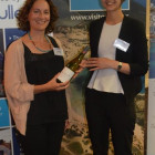 Sarah Martin Travel Counsellors wins a bottle of wine from Travel Bulletins Gemma Reeve