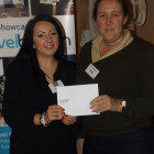 Nicola Johnson (left) from Lux Resorts presents Carolyn Pack from C The World with a ?100 Love2Shop voucher.