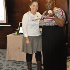 Andrea Sims, Visit California (left) presents Sarahlee Ettienne; Thomas Cook Marble Arch with an iPod Shuffle