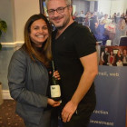 Nisha Tailor Jetset gives Alex Williams ( Blue Skies Travel ) a bottle of wine